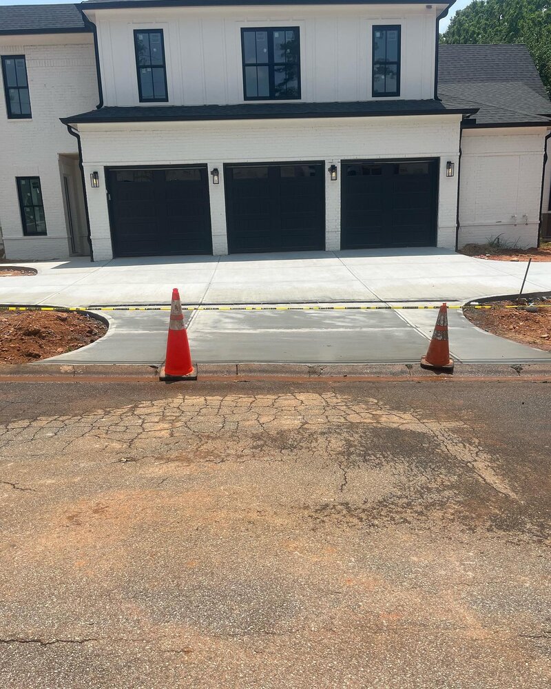 New construction driveway, sidewalks and walkway.