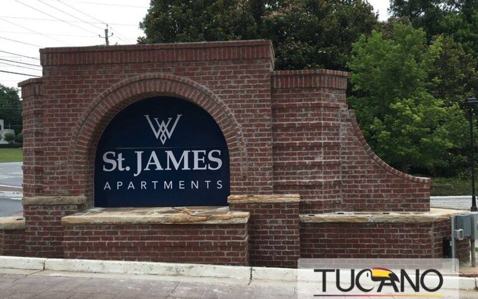 Custom brick monument sign with stone base and arched detail in Metro Atlanta